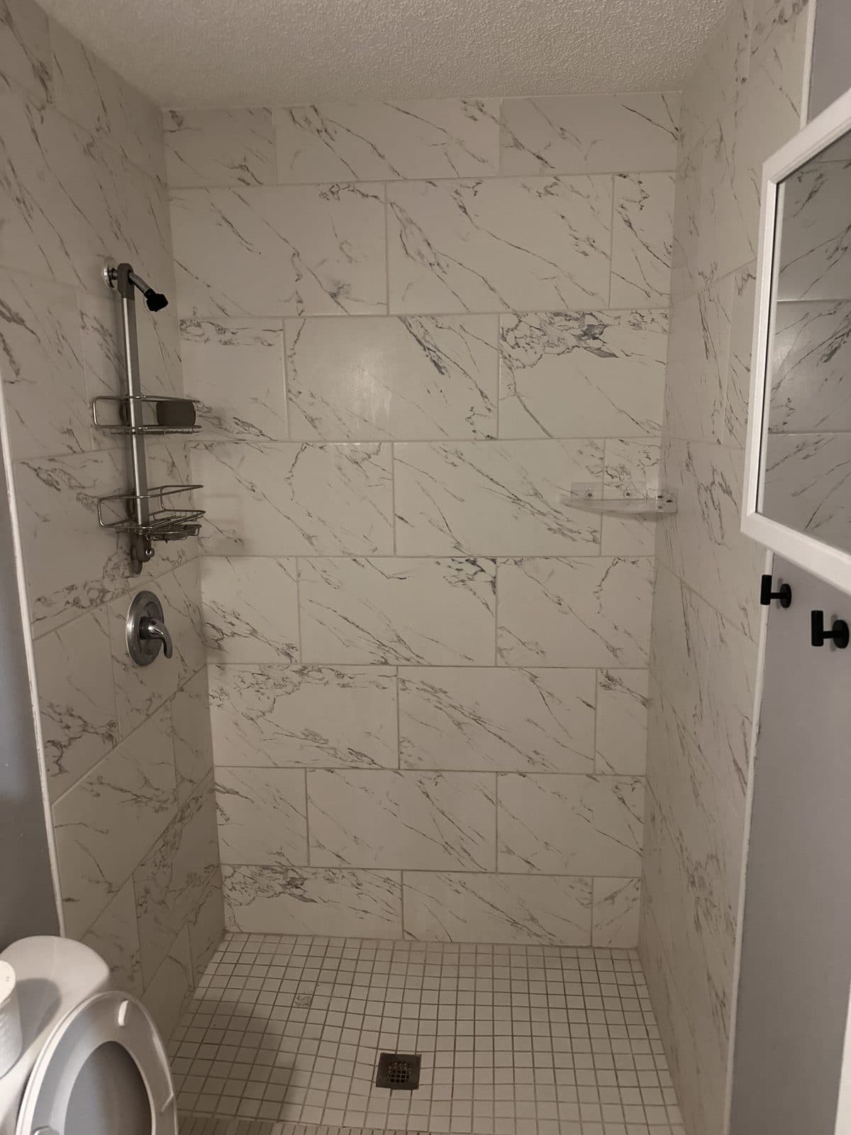 Dated shower to gray large-format with frameless glass — Before